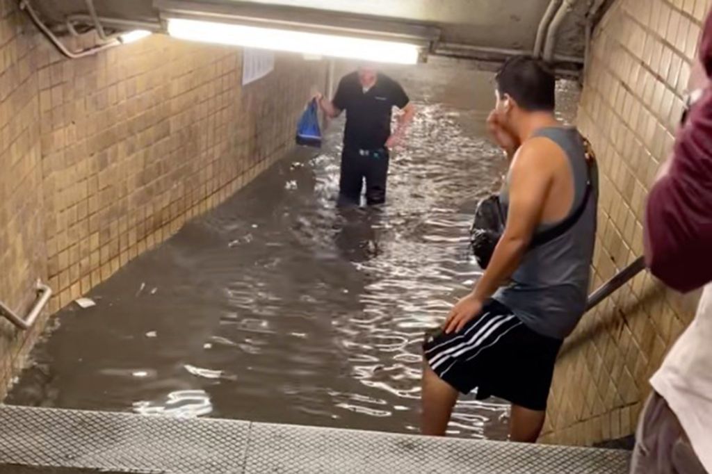 New Yorkers wade through underground lakes as subway stations&nbsp;flood